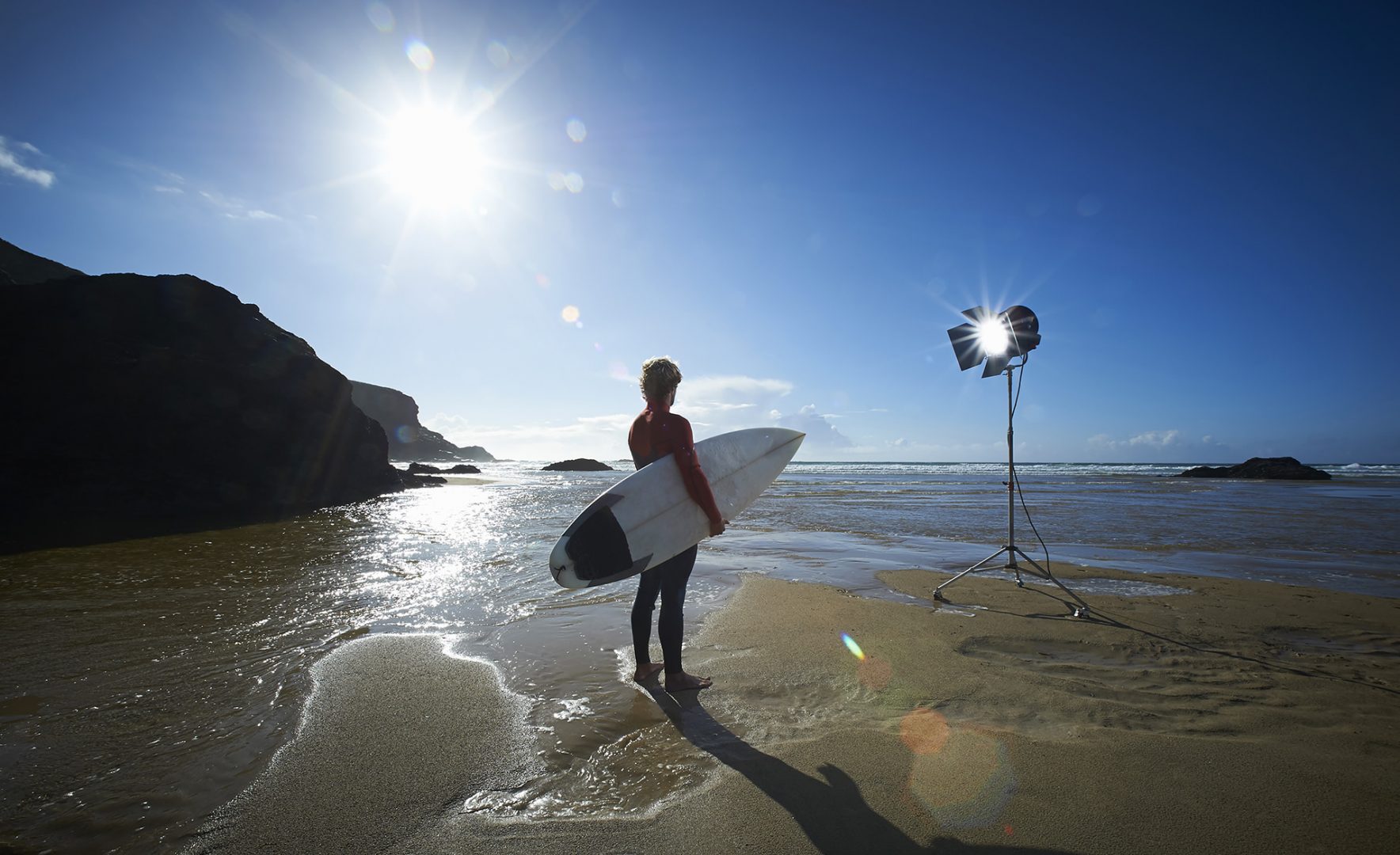 Photograph of a surfer on a Cornish beach